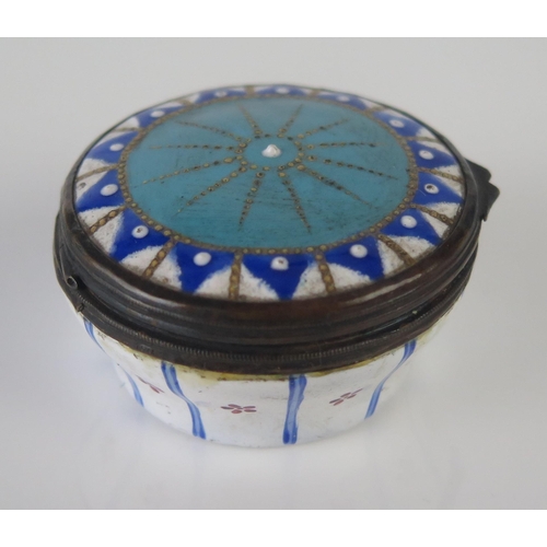 1188 - A 19th century enamel circular patch box, with hinged lid having geometric decoration, 4.5cm diamete... 