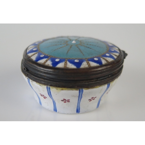 1188 - A 19th century enamel circular patch box, with hinged lid having geometric decoration, 4.5cm diamete... 