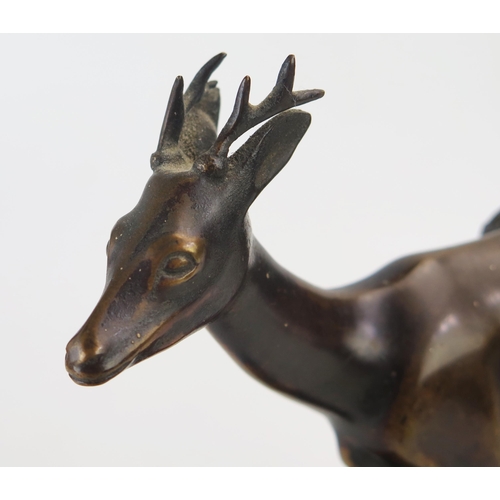 1193 - K R Muhlberger, bronze study of Pan seated on the back of a stag, raised on a rectangular plinth bas... 