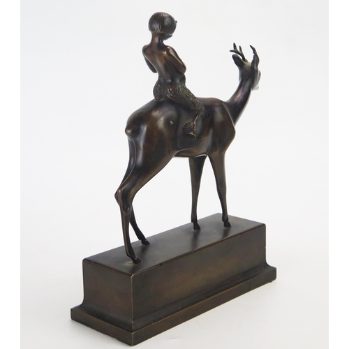 1193 - K R Muhlberger, bronze study of Pan seated on the back of a stag, raised on a rectangular plinth bas... 