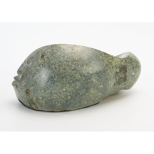 1194 - J Mura, a carved hardstone abstract fish with human face, signed J Mura, 28cm wide,