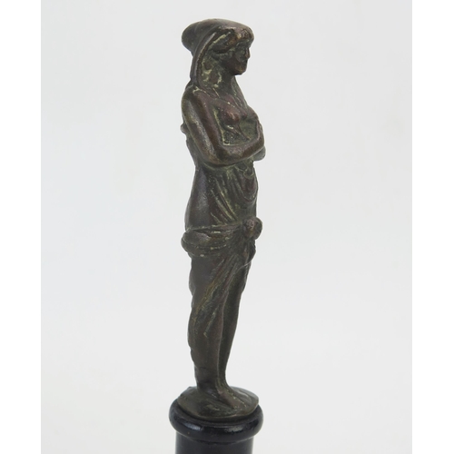 1195 - A Grand Tour bronze of a Roman woman, in long flowing robes, mounted on an ebonised base, 23cm high.