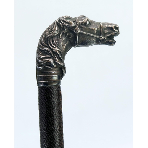 1199 - A leather bound riding crop with silver horse head handle, 62cm long.