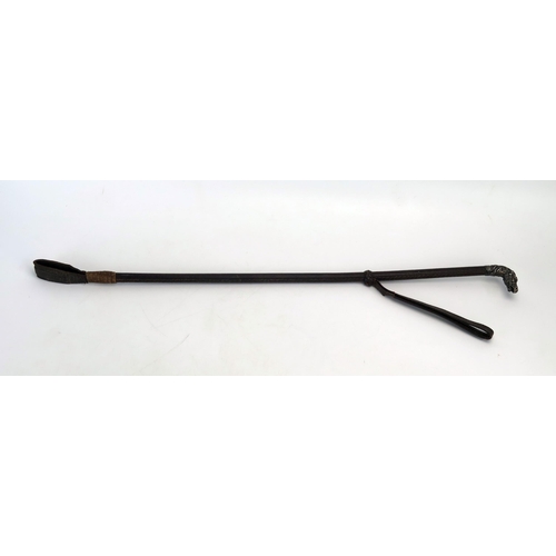 1199 - A leather bound riding crop with silver horse head handle, 62cm long.