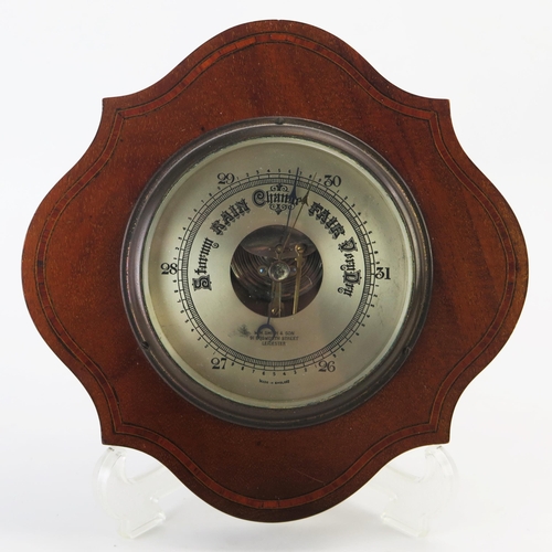 1275 - W H Smith & Son, an Edwardian mahogany and boxwood strung aneroid wall barometer, of cartouche shape... 