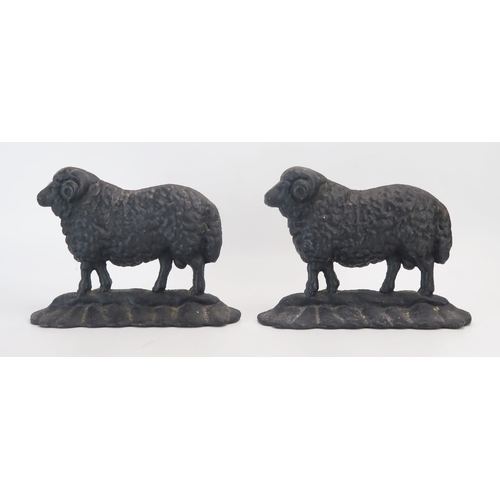 1282 - A pair of cast iron door stops in the form of rams, 19cm high.