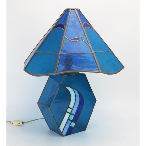 1288 - A leaded glass table lamp in the Mackintosh style with octagonal multi-coloured shade, on a lozenge ... 