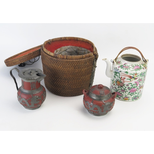 1302 - A Cantonese famille verte kettle, contained in a wicker case, (lacks cover), together with a terraco... 