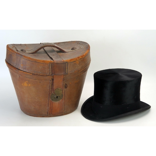 1309 - Henry Heath, a top hat, contained in a stitched leather case. Inner circumference of hat 55.5cm