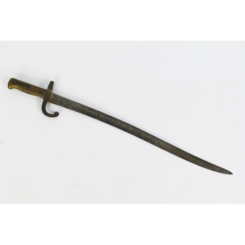 1316 - A French Chassepot bayonet, with 57cm curved triangular inscribed and fullered blade, with ribbed br... 