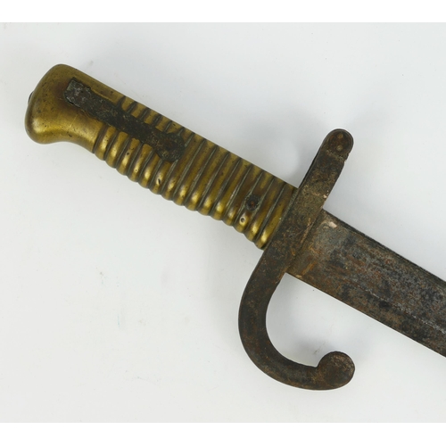 1316 - A French Chassepot bayonet, with 57cm curved triangular inscribed and fullered blade, with ribbed br... 