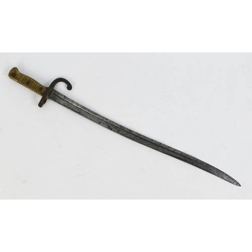 1316 - A French Chassepot bayonet, with 57cm curved triangular inscribed and fullered blade, with ribbed br... 