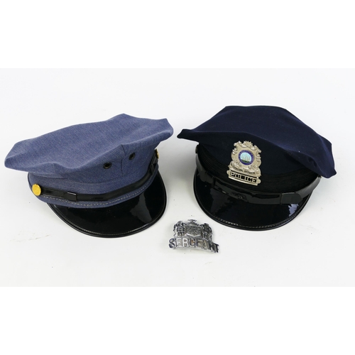 1322 - Two American police officers peaked caps.