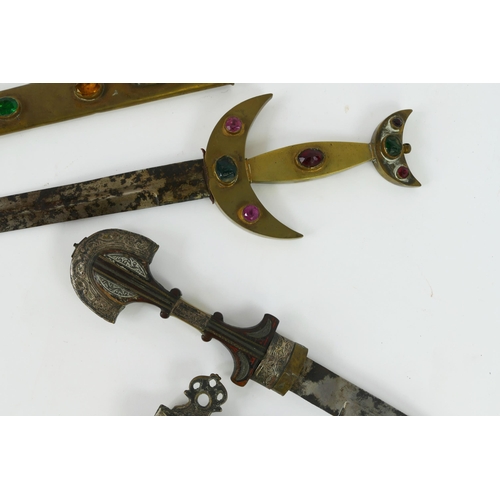 1338 - A Moroccan Koumaya dagger, with 26cm curved double edged blade, with shaped wood and silver inlaid g... 