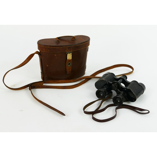 1340 - A pair of Clotz 6 x 25 filed glasses contained in a stitched leather case,