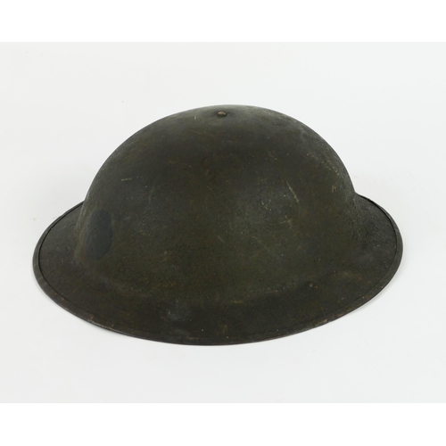 1346 - An American World war One steel helmet with liner.