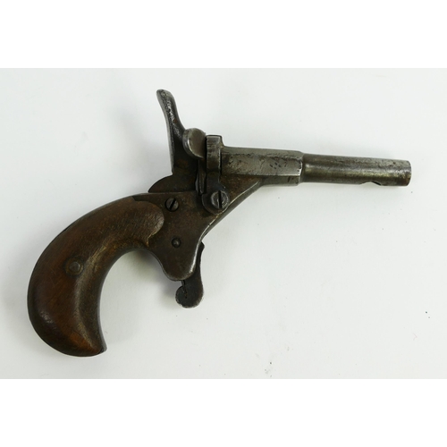 1355 - A World War I or II canvas Red Cross helmet cover, together with a starting pistol.