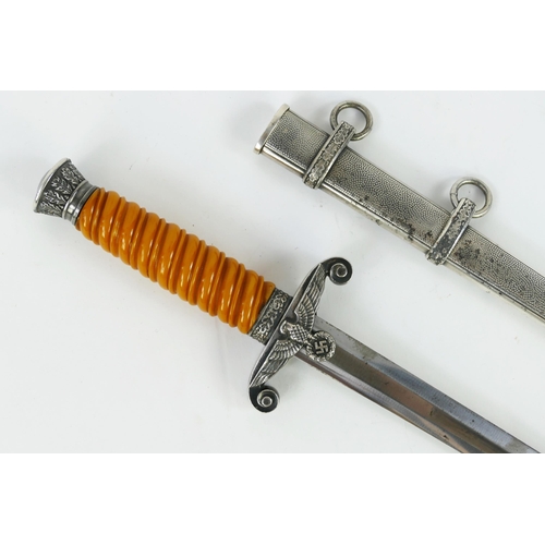 1361 - A World War II period German Army Officers Dagger, with 25cm blade by C. Eickhorn, with orange cellu... 