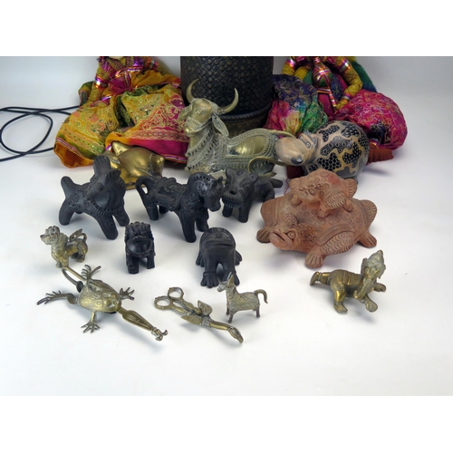 1387 - A cat brass model of a water buffalo, two Indian puppets, metal animals, terracotta figures etc.