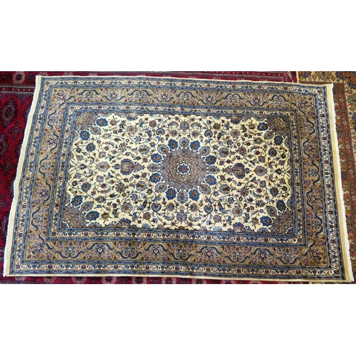 1393 - A Meshed rug, the ivory field with central circular floral medallion, with beige floral spandrels en... 