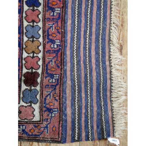 1397 - A Caucasian rug, the ivory field with four serrated lozenge medallions, enclosed by a triple geometr... 