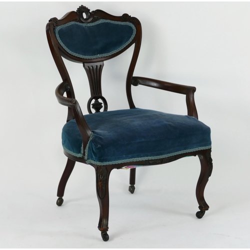 1414 - A late Victorian/Edwardian mahogany salon elbow chair, with shaped and padded top rail, stuff over s... 