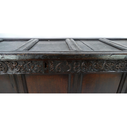 1415 - A 17th century  coffer of large size, with five panelled hinged lid and front with foliate frieze da... 