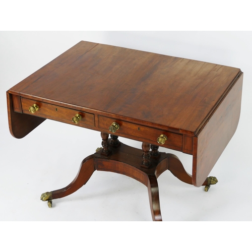 1421 - A 19th century mahogany sofa table, the rectangular top with hinged leaves above a pair of frieze dr... 