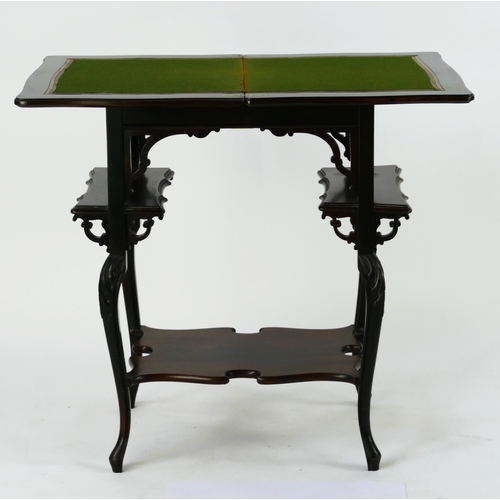 1423 - An Edwardian mahogany card table, the hinged top with a moulded edge, raised on four swept legs link... 