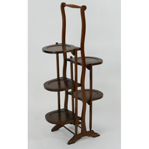 1429 - An Edwardian oak five tier folding cake stand, 92cm high.