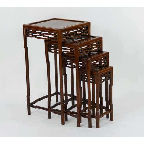 1433 - A nest of four Chinese occasional tables, with square tops raised on simulated bamboo legs,  linked ... 