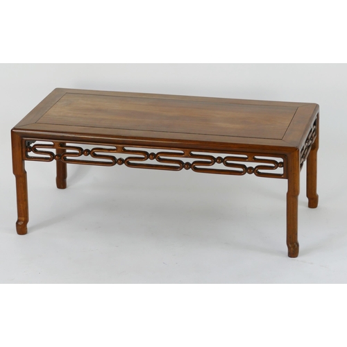 1434 - A Chinese hardwood low alter table, the rectangular top, with pierced frieze, raised on turned  simu... 