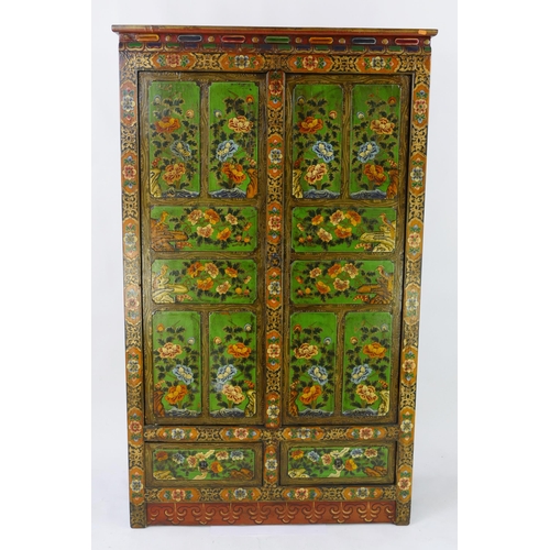 1436 - An Indian polychrome decorated cupboard, the plain top with moulded frieze, above a pair of floral d... 