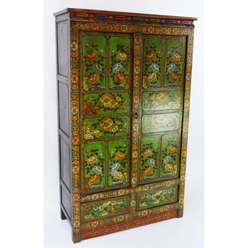 1436 - An Indian polychrome decorated cupboard, the plain top with moulded frieze, above a pair of floral d... 