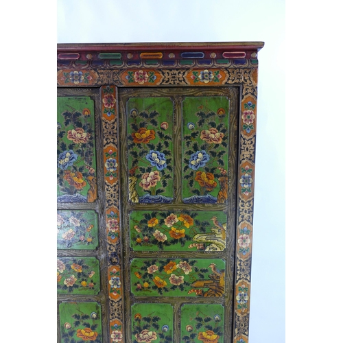 1436 - An Indian polychrome decorated cupboard, the plain top with moulded frieze, above a pair of floral d... 