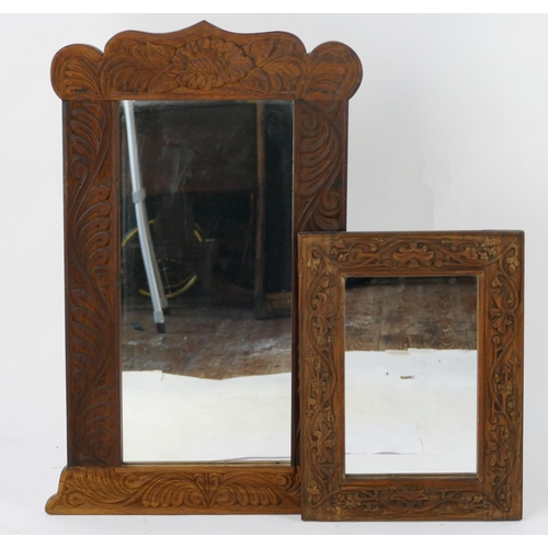 1440 - An Indian carved hardwood wall mirror, with rectangular mirror plate, 77cm high, 51cm wide