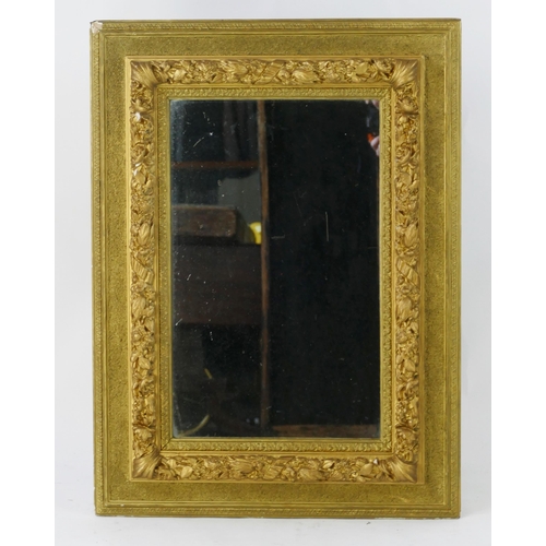 1445 - A gilt framed wall mirror with moulded floral decoration having a rectangular mirror plate, 83 x 61 ... 