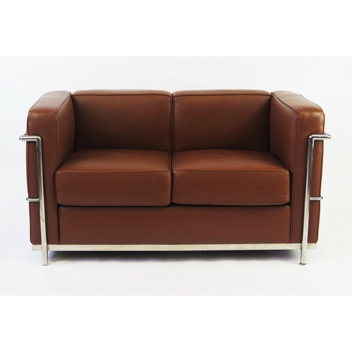 1459 - A Le CorbusierLC2 style two-seater settee with tan leatherette upholstery with chromed tubular frame... 