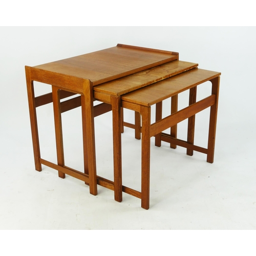 1460 - A nest of three Hans Wegner style occasional tables, of rectangular outline,  60cm wide, 49cm high, ... 