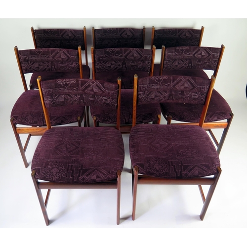 1462 - A set of eight Danish rosewood dining chairs, with padded curved top rail, with stuff over seat on o... 