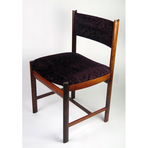 1462 - A set of eight Danish rosewood dining chairs, with padded curved top rail, with stuff over seat on o... 