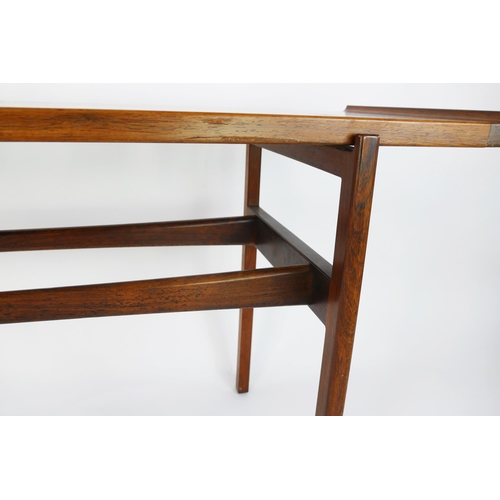 1465 - A Danish rosewood side table by Finn Juhl for Vodder, the rectangular top with swept ends, raised on... 