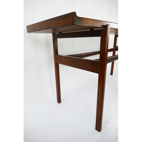 1465 - A Danish rosewood side table by Finn Juhl for Vodder, the rectangular top with swept ends, raised on... 