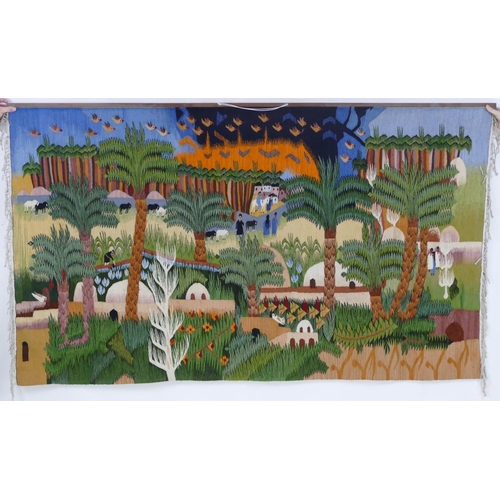 846 - A North African woven tapestry, depicting a village, with figure working in the fields, animals, pal... 