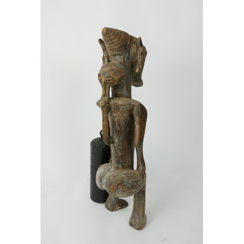 872 - An African Luba Carved Wooden Figure of an Elderly Female with mask to the back, 48cm