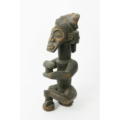 874 - An African Carved Wooden Seated Figure of a Male, 31cm