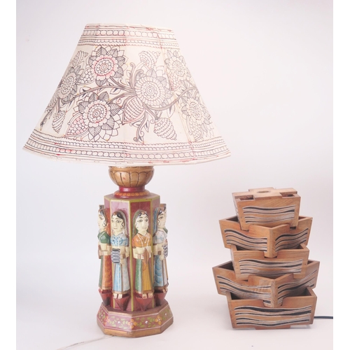 880A - An Indian carved hardwood and polychrome decorated table lamp. of octagonal outline decorated with f... 