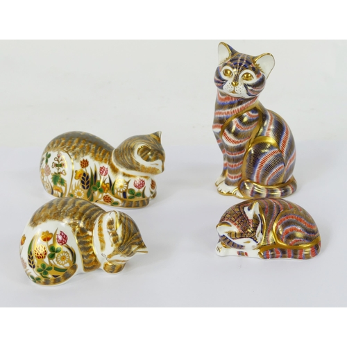 1149 - Four Royal Crown Derby cat ornaments, two with Imari style  palette and two with floral decoration. ... 