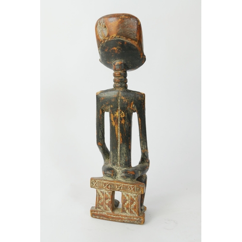 873 - An Asante Carved Wooden Figure of a Seated Male, 33cm