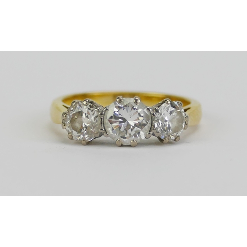 1 - A Three Stone Diamond Ring in a precious yellow metal setting, sold with a 1997 Bruford & Son insura... 